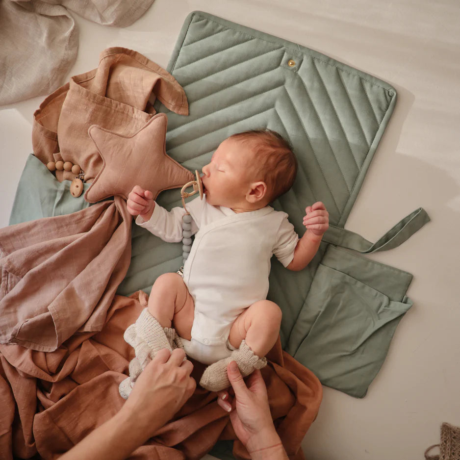 Roman Green Mushie Portable Changing Table